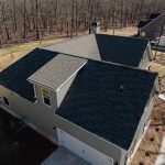 An aerial view of a brown shingle roof on a home near Peachtree City, GA.